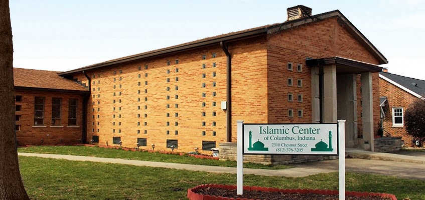 The brick masjid building on Chestnut Street with the Islamic Center of Columbus, Indiana sign on the front lawn